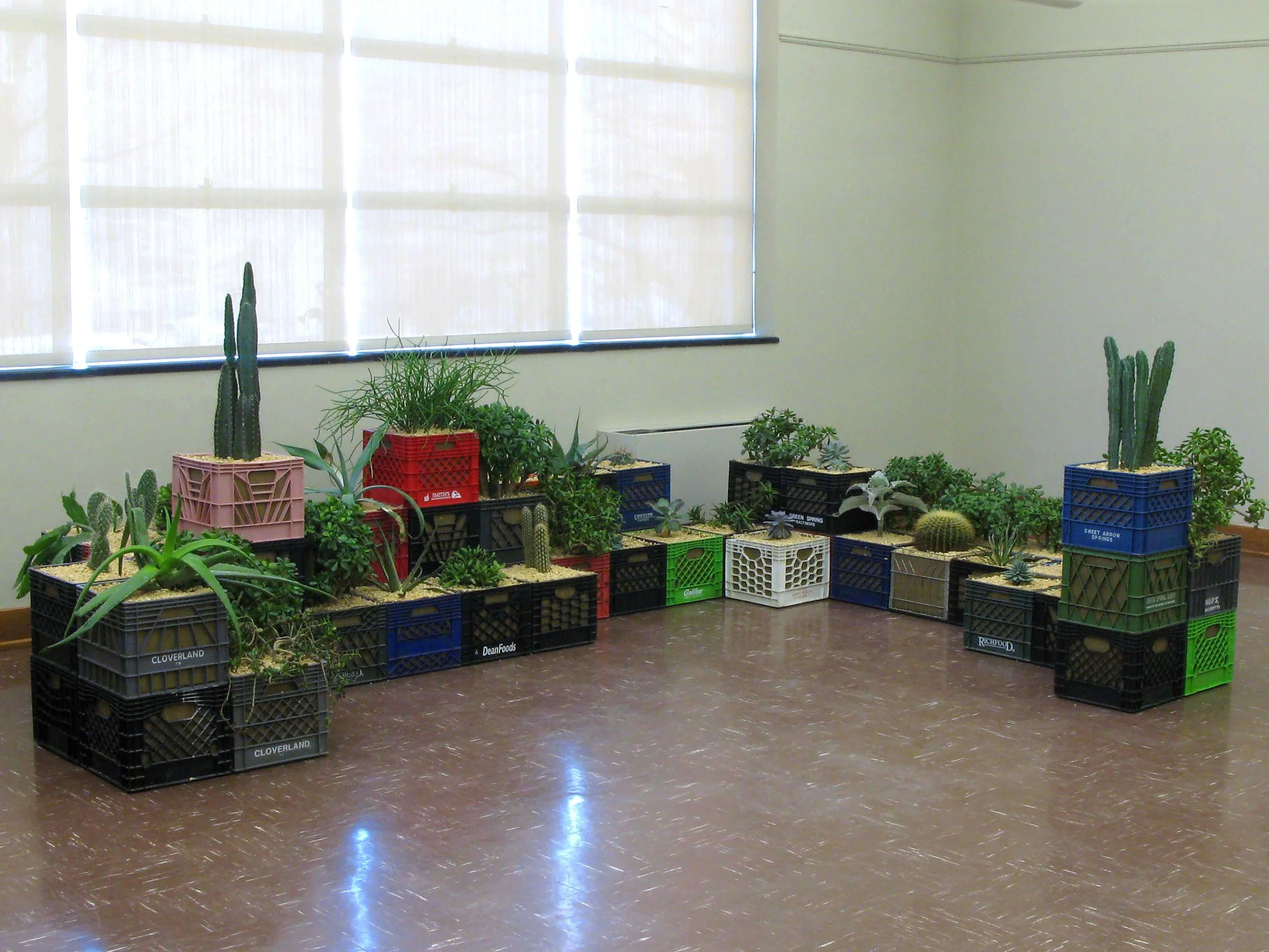 Pioneers / 2008 / Milk crates, burlap, gravel, soil, succulent plants / 5’ x 14’ x 10’
