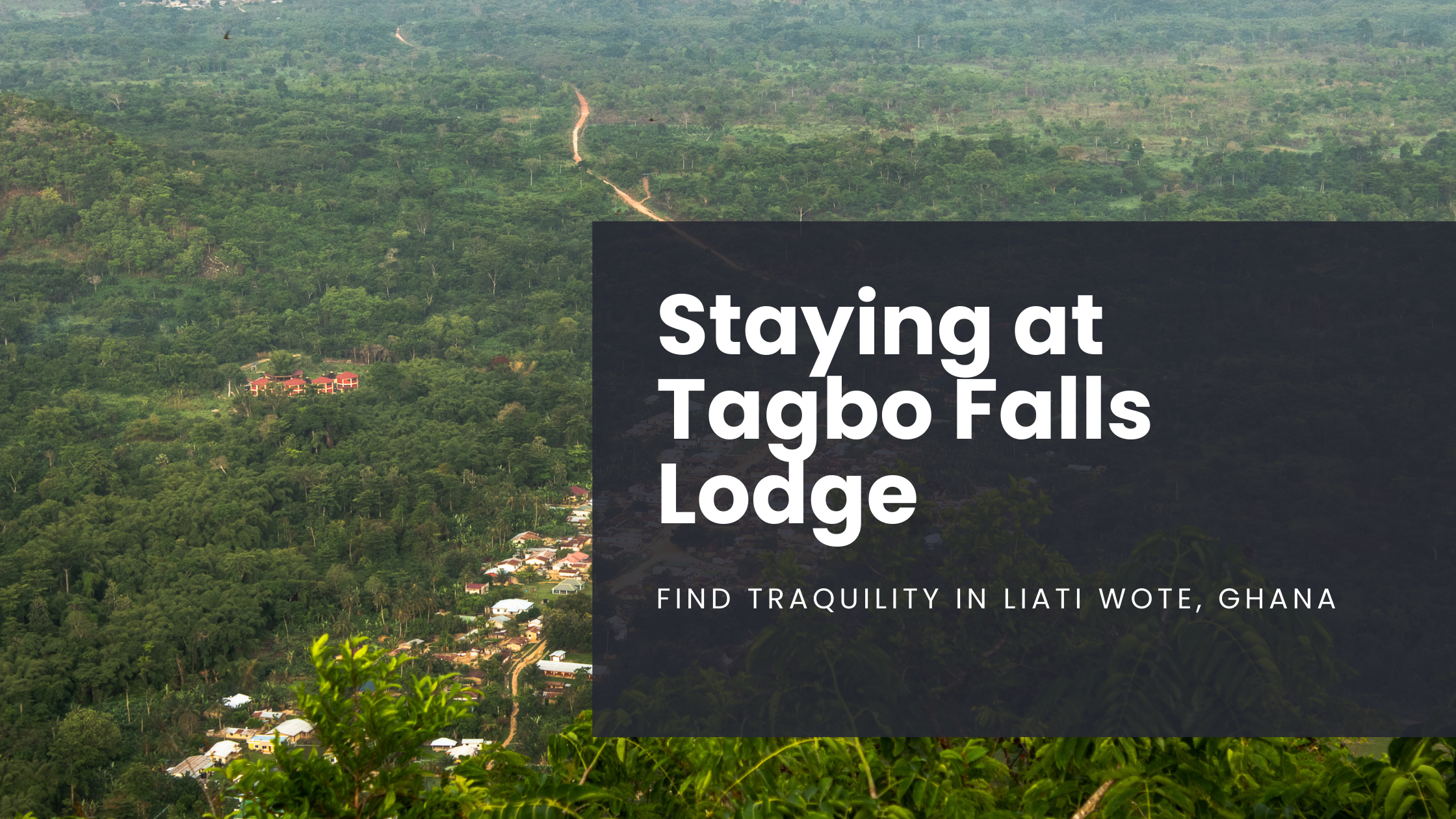 An aerial view of the small village of Liati Wote in Ghana, surrounded by greenery and forest