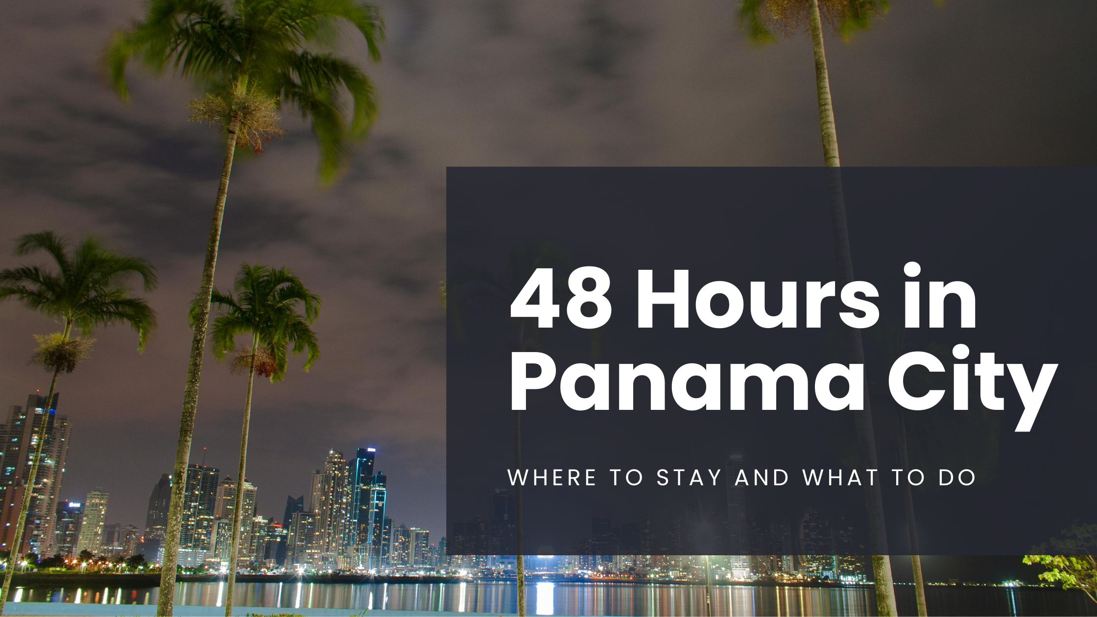 The city lights of Panama City, Panama shine bright in the middle of the night, reflecting off the harbor as seen from the Amador Causeway