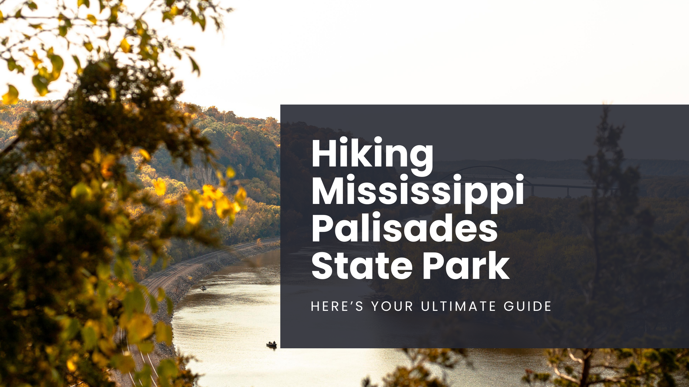 The view of the Mississippi River with a lone boater on the water, as seen from a viewpoint along a trail at Mississippi Palisades State Park in Illinois