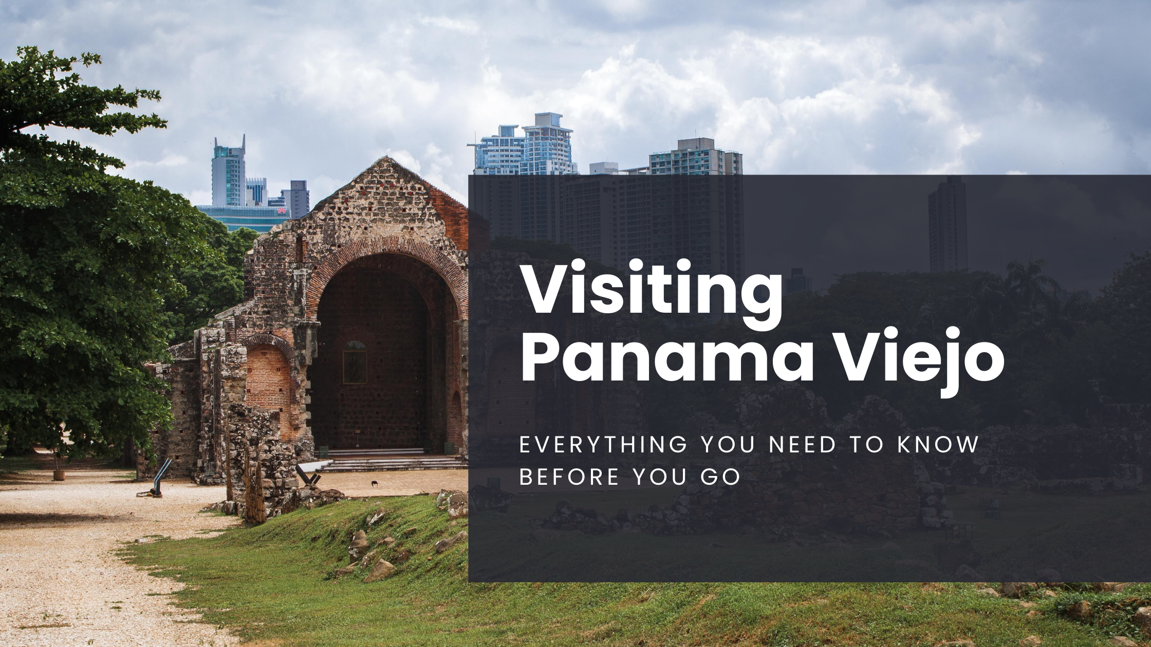 The ruins of a cathedral in Panama Viejo sit in the foreground, a stark contrast to the modern building of Panama City that sit in the background