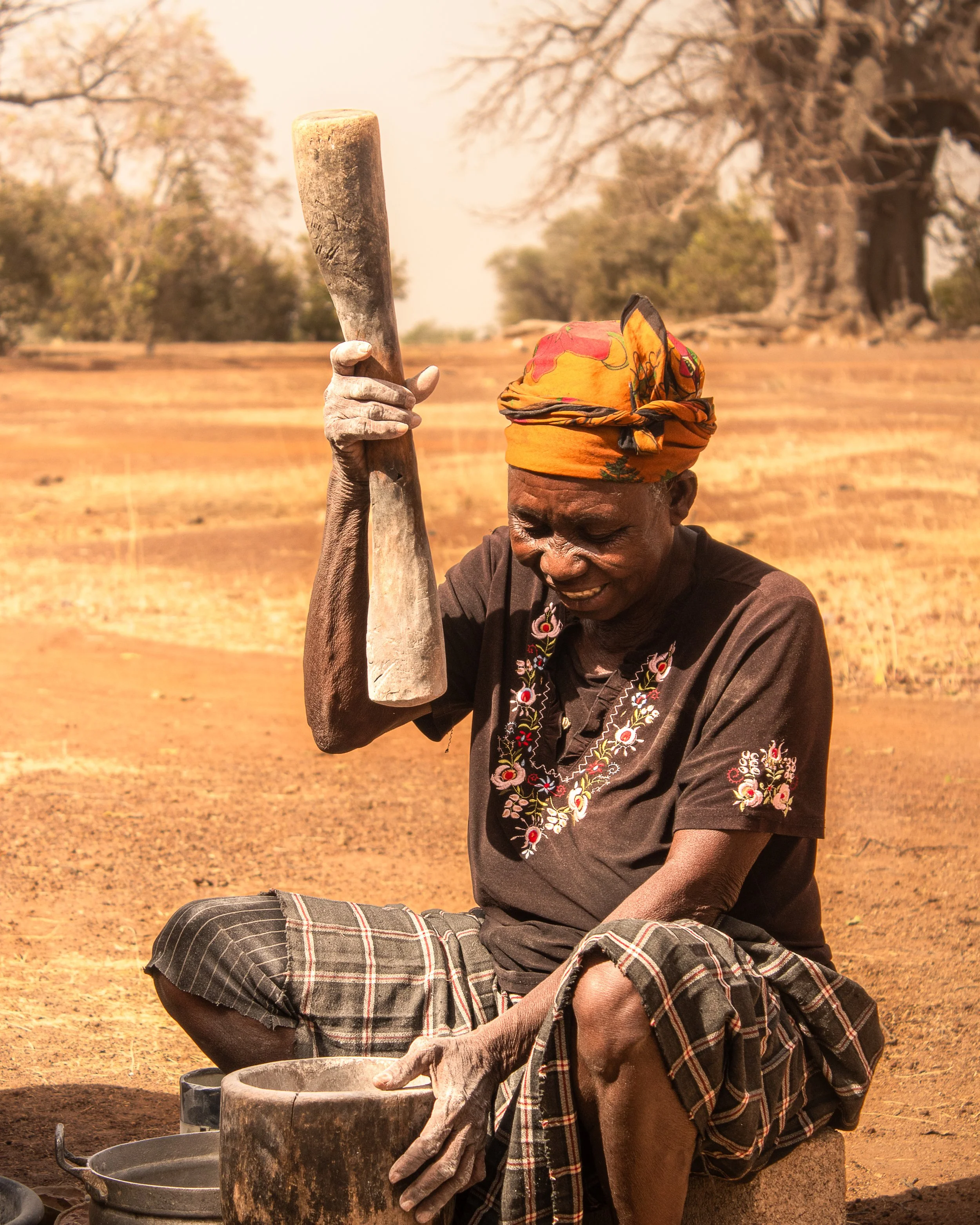 A woman processes baobab powder in Northern Ghana
