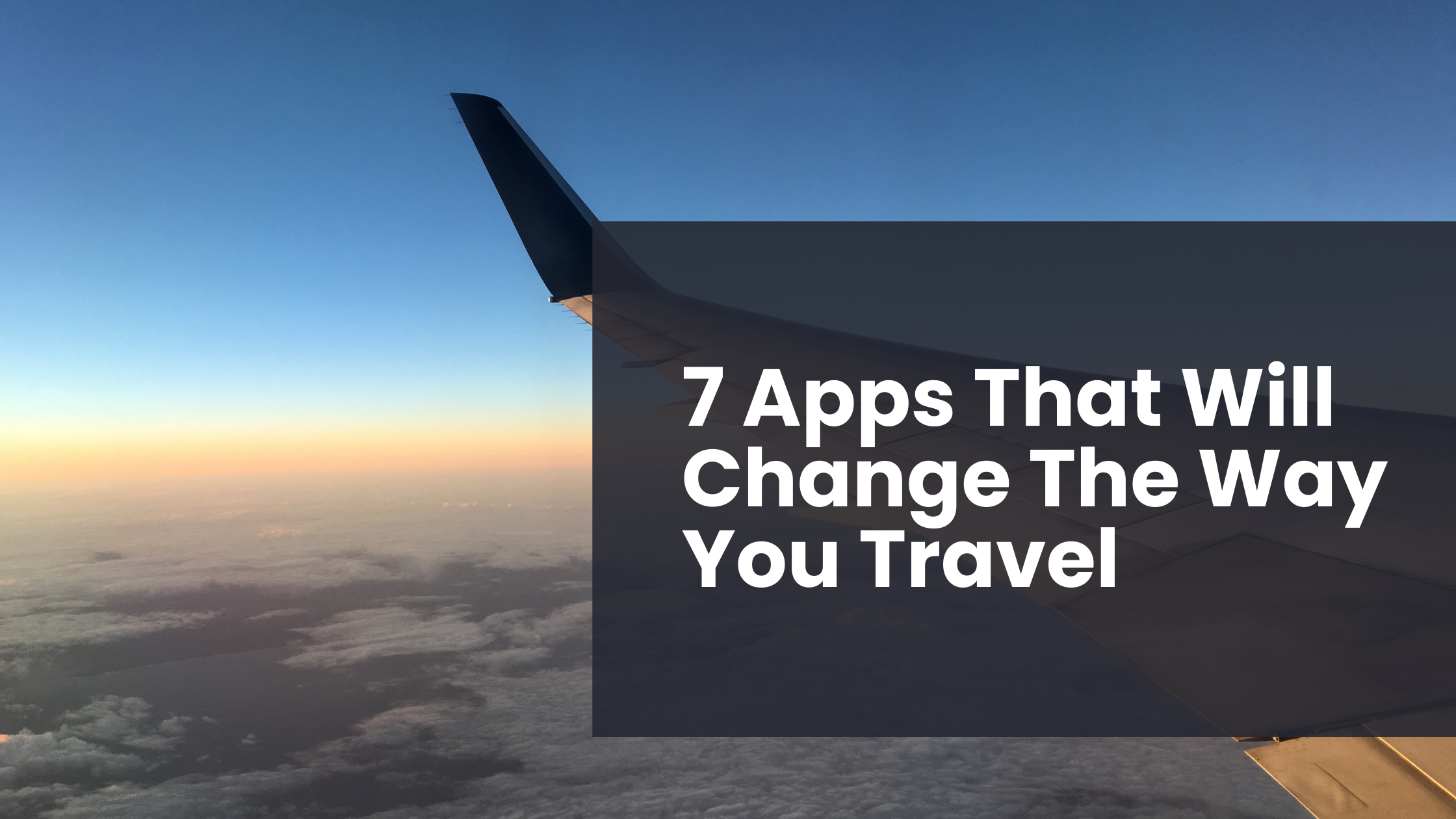 A wing of an airplane sits with the sunset from the window seat of a plane in the background. This is a feature image for a blog post about using apps while traveling