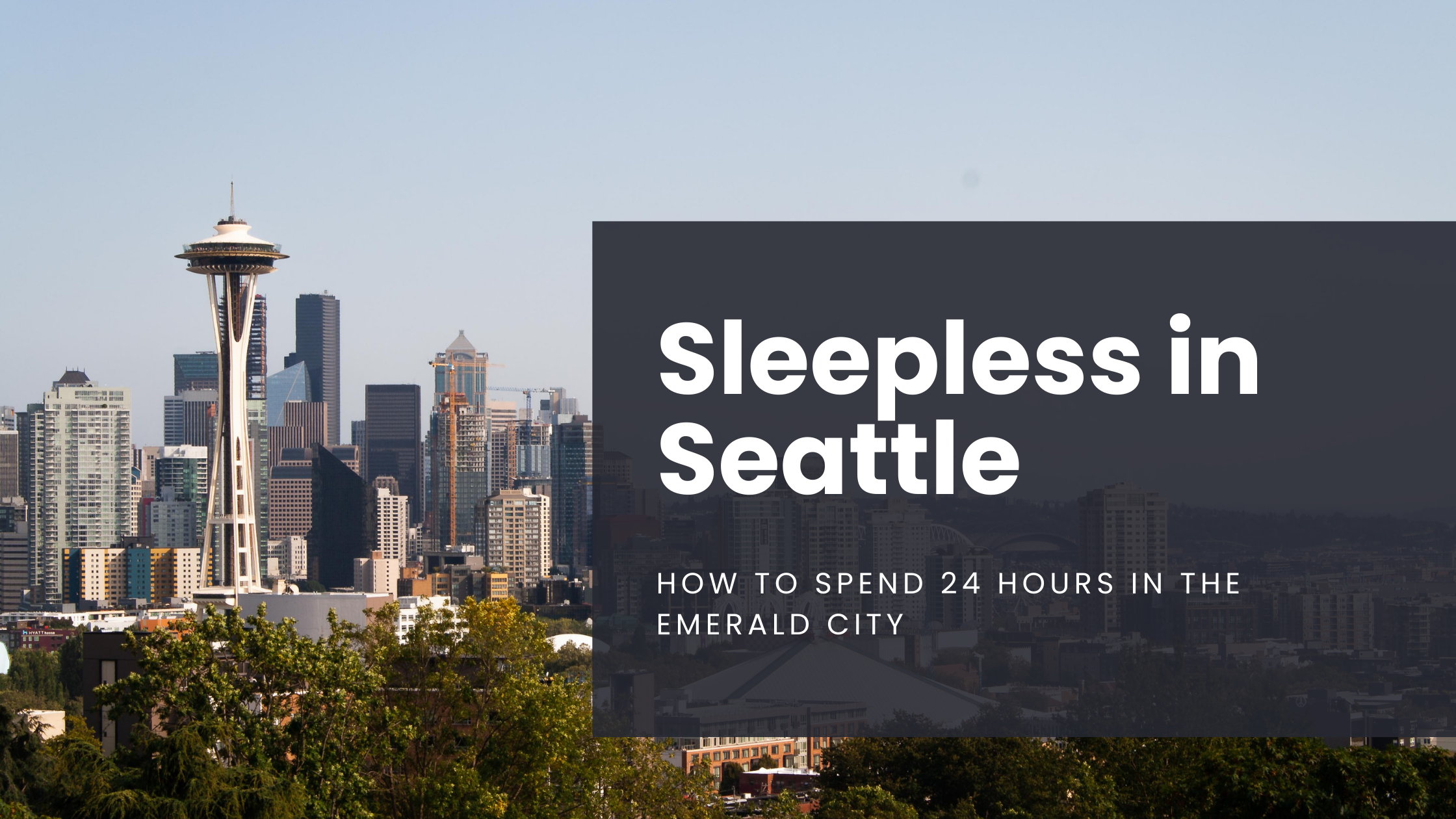 The Space Needle dominates the Seattle skyline on a clear day