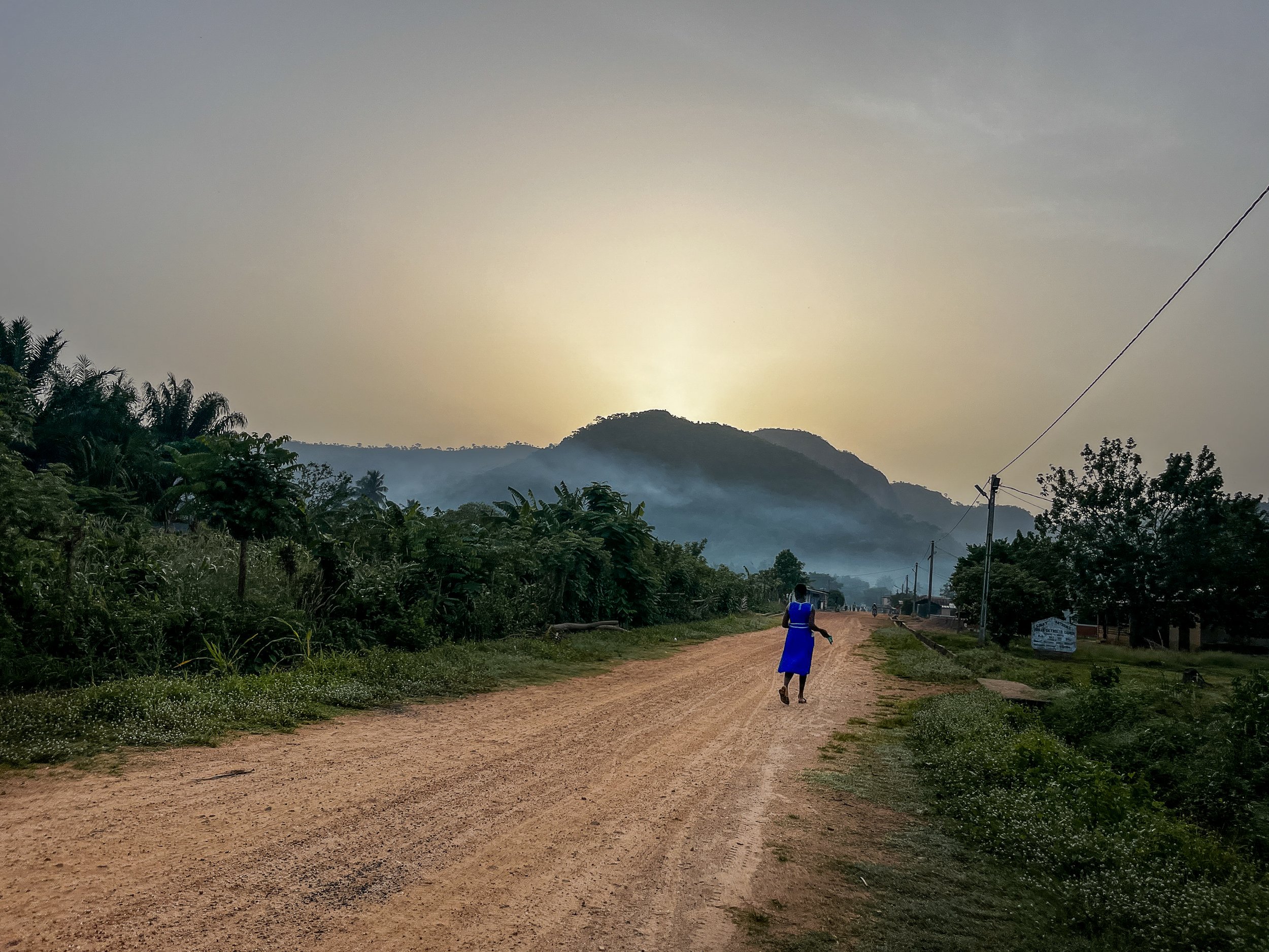 The sun rises behind Mount Afadjato in Liati Wote, Ghana