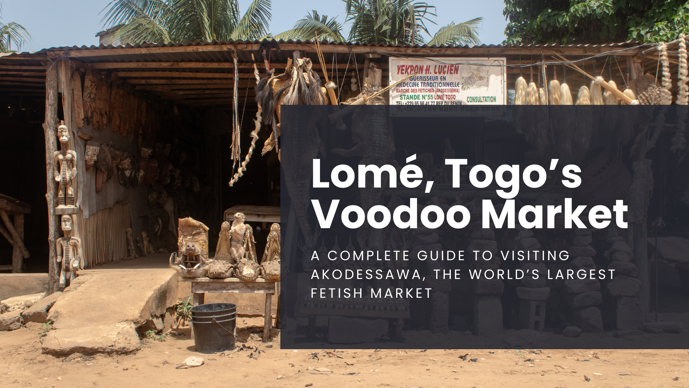 A market stall at the world's largest voodoo market in Lome, Togo sits amongst a dusty pathway, selling dried animal skins, carcasses, and more