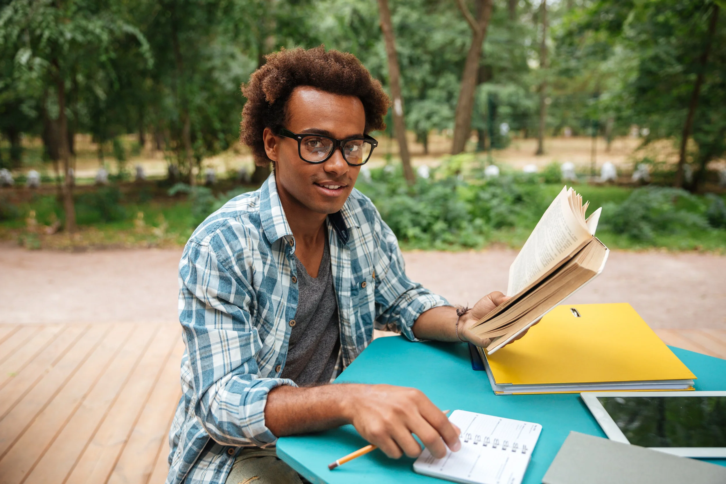 happy-african-man-studying-outdoors-PPCCVWY.jpg