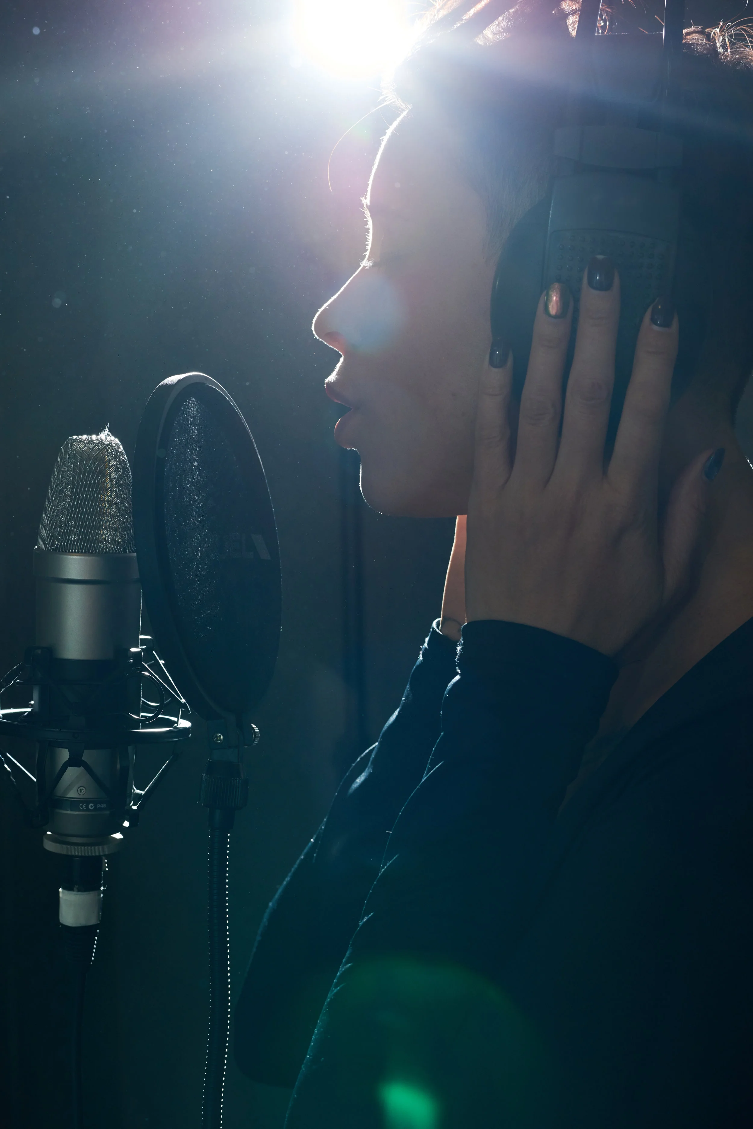tender-singer-in-headphones-recording-music-GLTW4PA.jpg