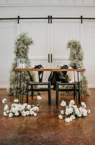  rentals pictured:  -nash - modern wood desk $30  -brit - black modern boho chairs $15  -black iron glass hurricanes (assorted sizes) $7.00 each 