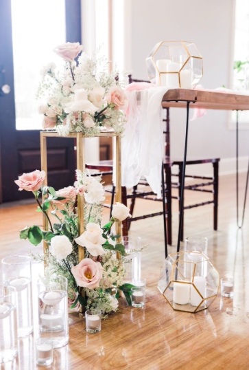  rentals pictured:  -floating vases (assorted heights) from $0.75  -solo tealight candle holders $0.50  -gold hexagon terrarium $8.00  -NASH - modern wood table $30.00 