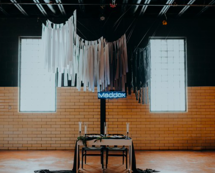  rentals pictured:  -all white modern desk $30  -brit - black modern boho chairs $15 each  -black metal trio candlestick holders $9.00 for set  -candle stick hurricane $3.00 each 