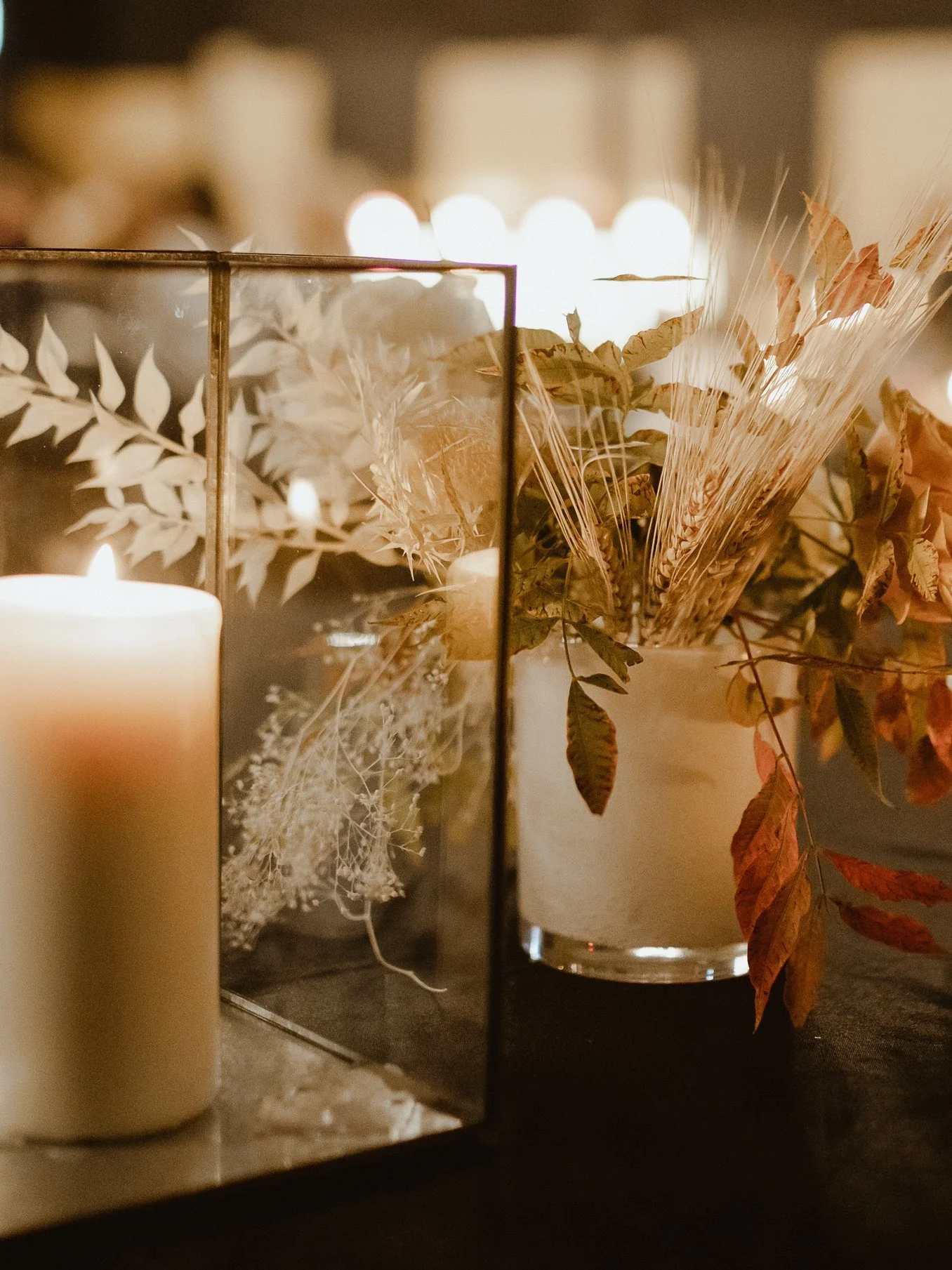  rentals pictured:  -black iron glass hurricane (assorted sizes available) $7.00 each  -white handblown glass hurricane trio (assorted sizes) $5.00 for set  -black table cloths (various sizes) $11.00 each 
