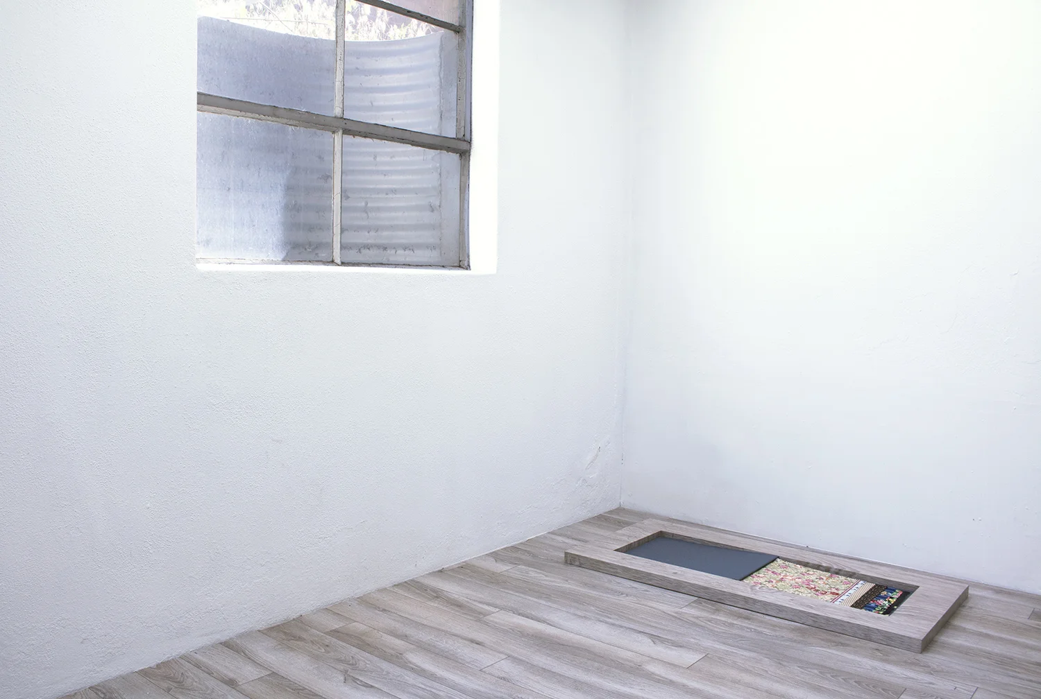 Floor Paintings , 2018 Acrylic on MDF on floor Faulty Samples IV , 2014–2018 Fabric collages and acrylic on found fabric in bound book