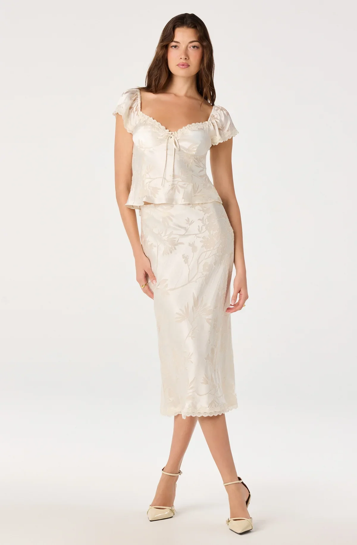 Vanessa floral cap sleeve top in cream worn with a satin midi skirt