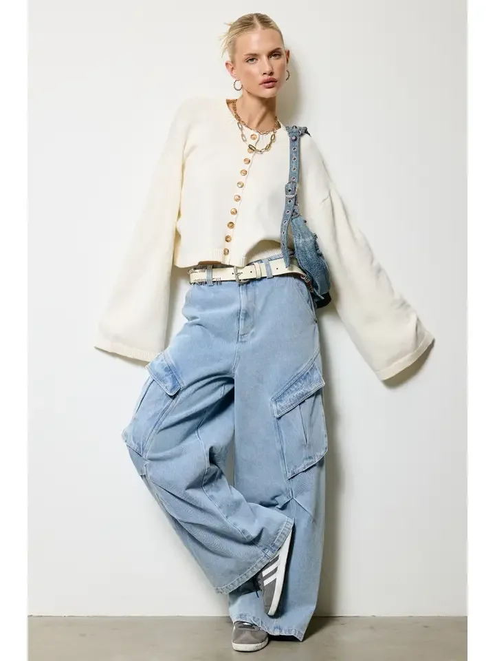 Full-length view of the button front cropped cardigan in bone