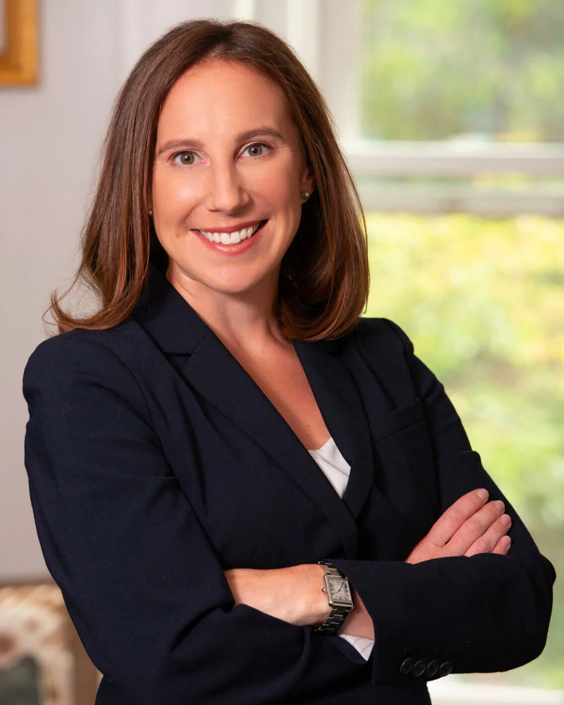 Rebecca Cohen, fundraiser and grant consultant, smiling, wearing a blazer, arms crossed