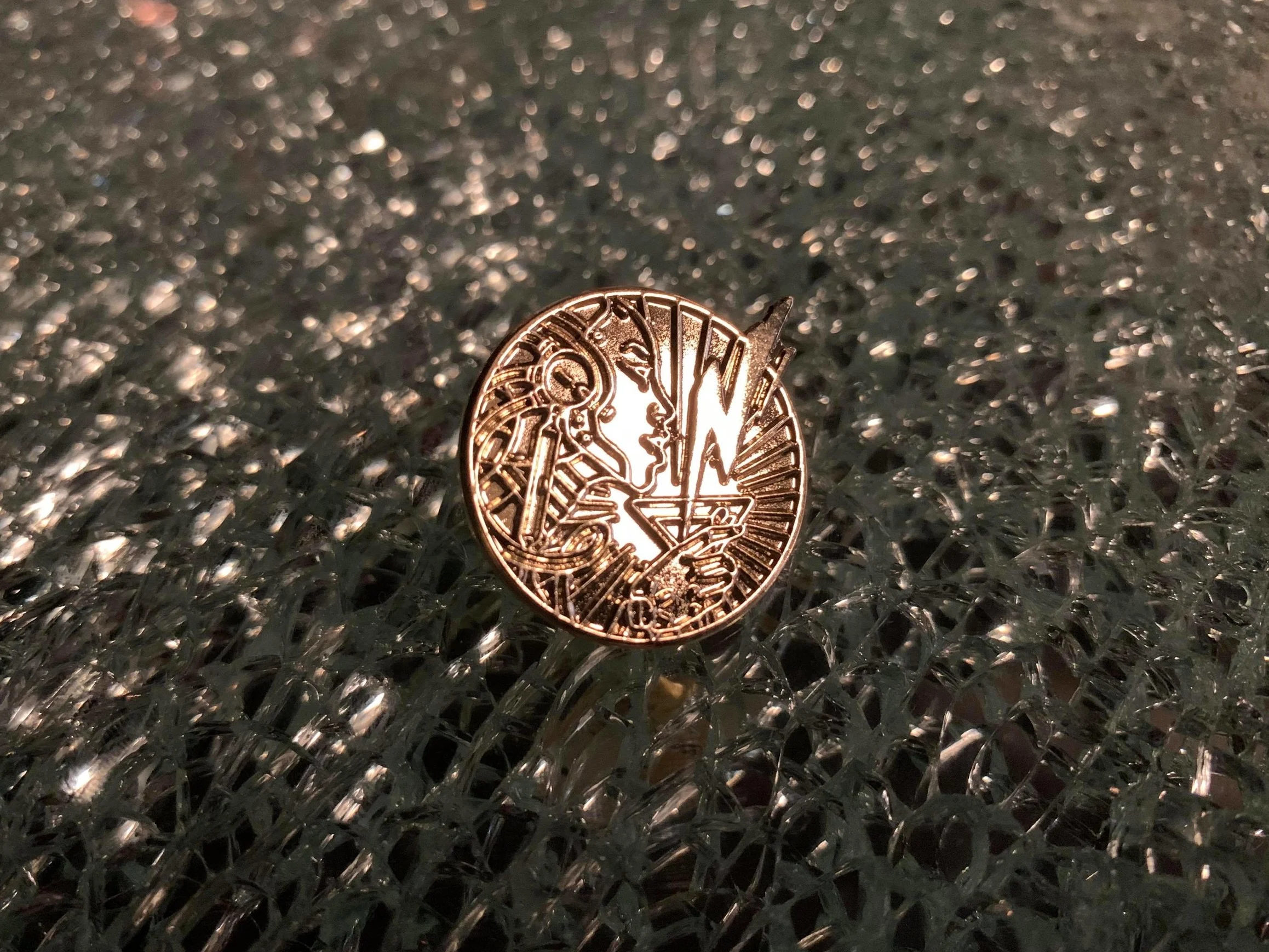 Brass lapel pin - $8
