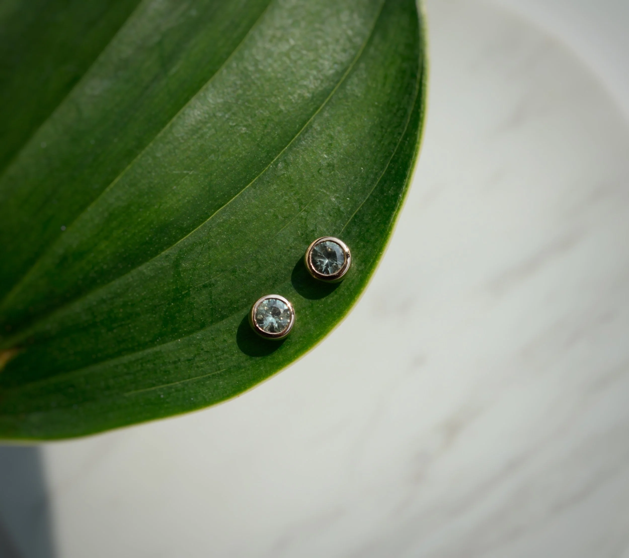 Rose gold light green sapphire studs
