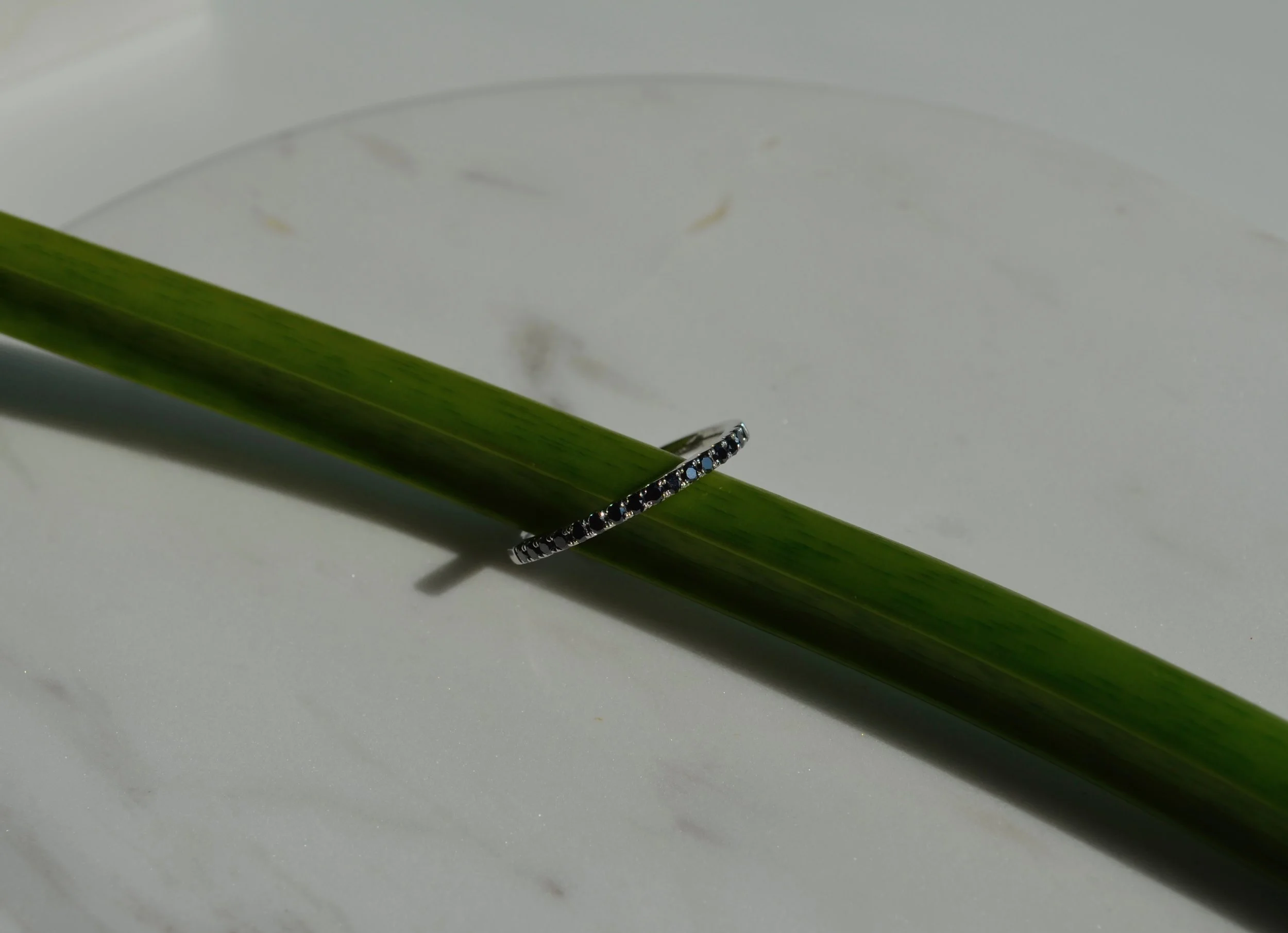 White gold ring with black diamonds