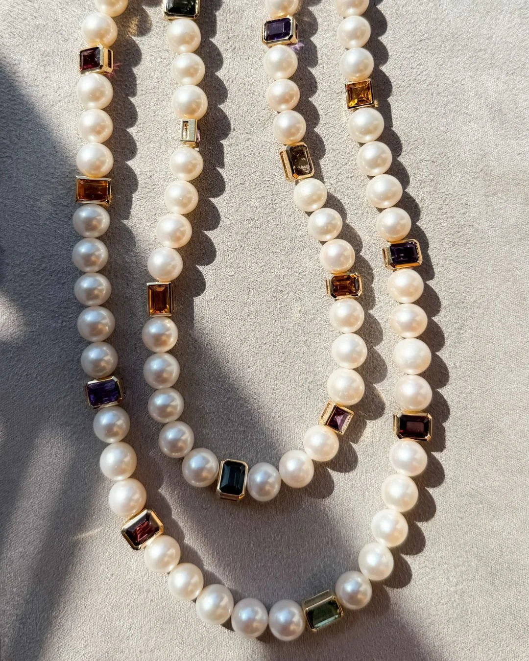 Double Pearl Coloured Necklace.
A bespoke pearl necklace, designed using the client&rsquo;s own coloured stones.Originally conceived as one piece, it naturally became two necklaces, able to stand alone or be worn together.

Thoughtful details, carefu