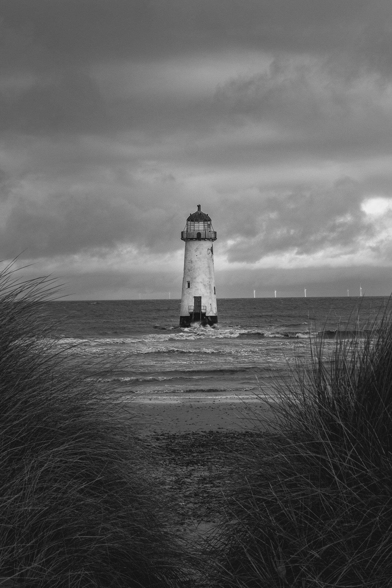view of talacre lighthouse from behind sand dunes.JPG