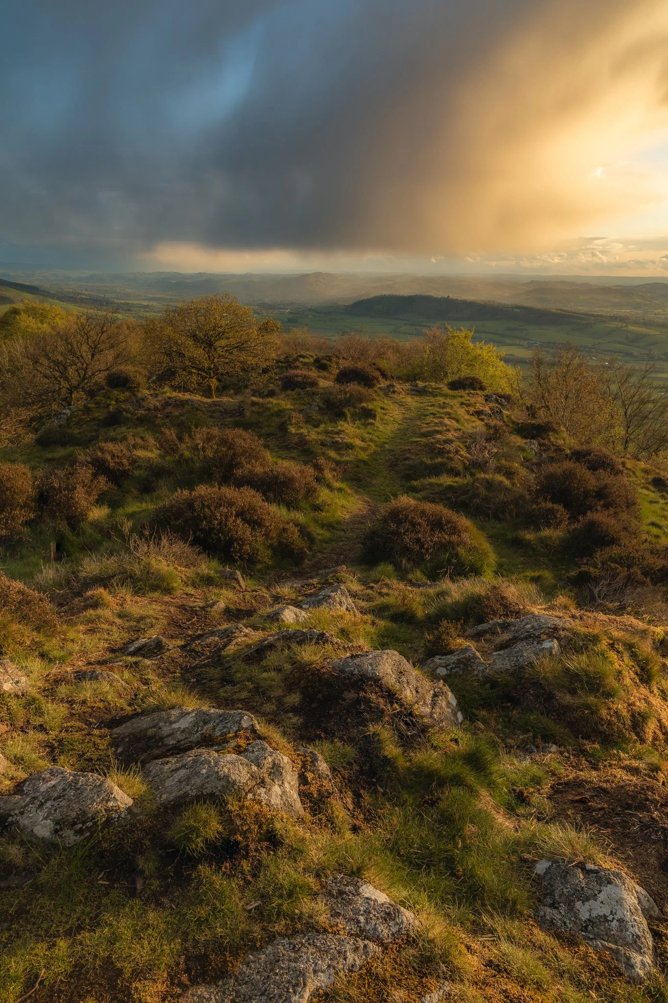  Stormy skies meet a burning sunset and sweep over the sky to cover Welshpool. 