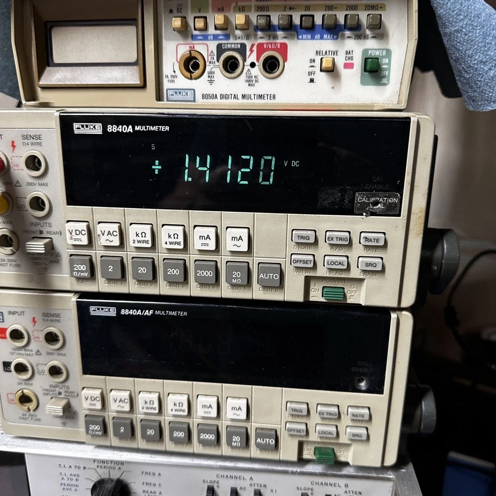 Fluke 8840 precision bench multi-meter showing voltage measurement for the 3rd battery.
