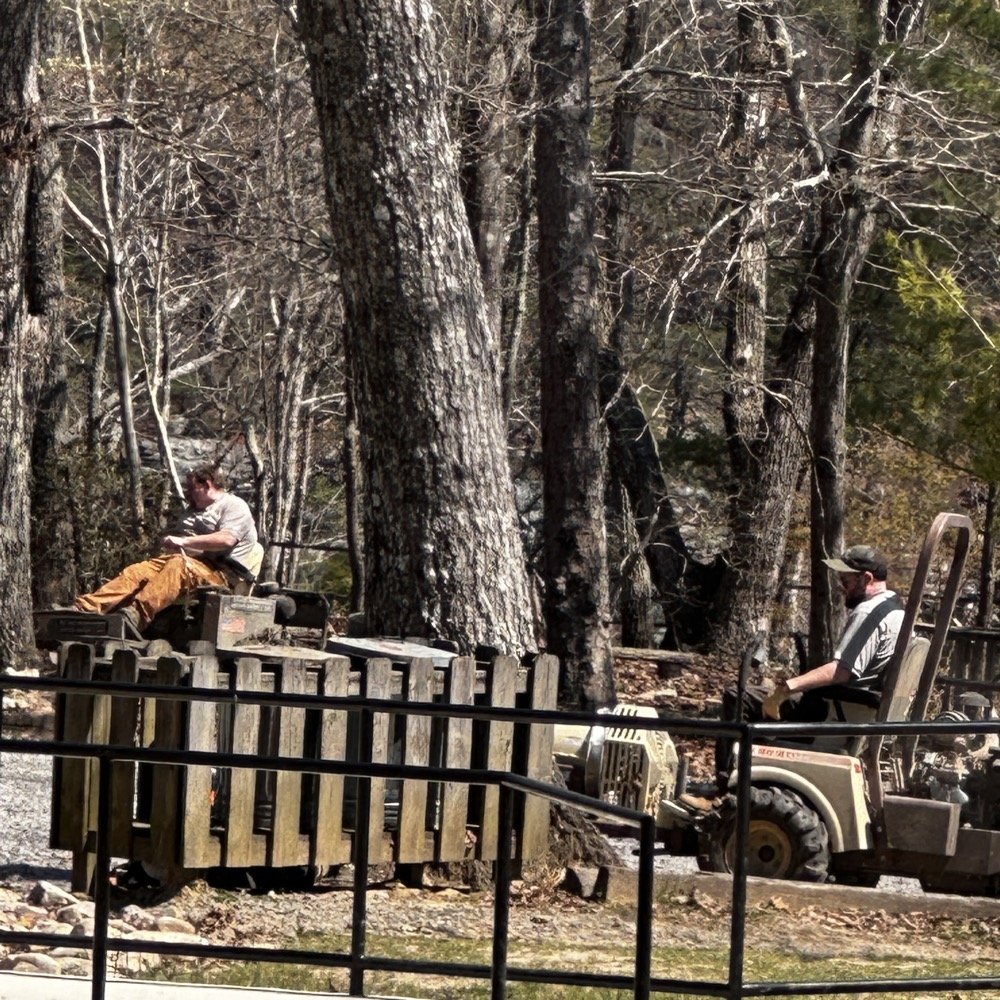State park grounds keepers doing lawn maintenance.