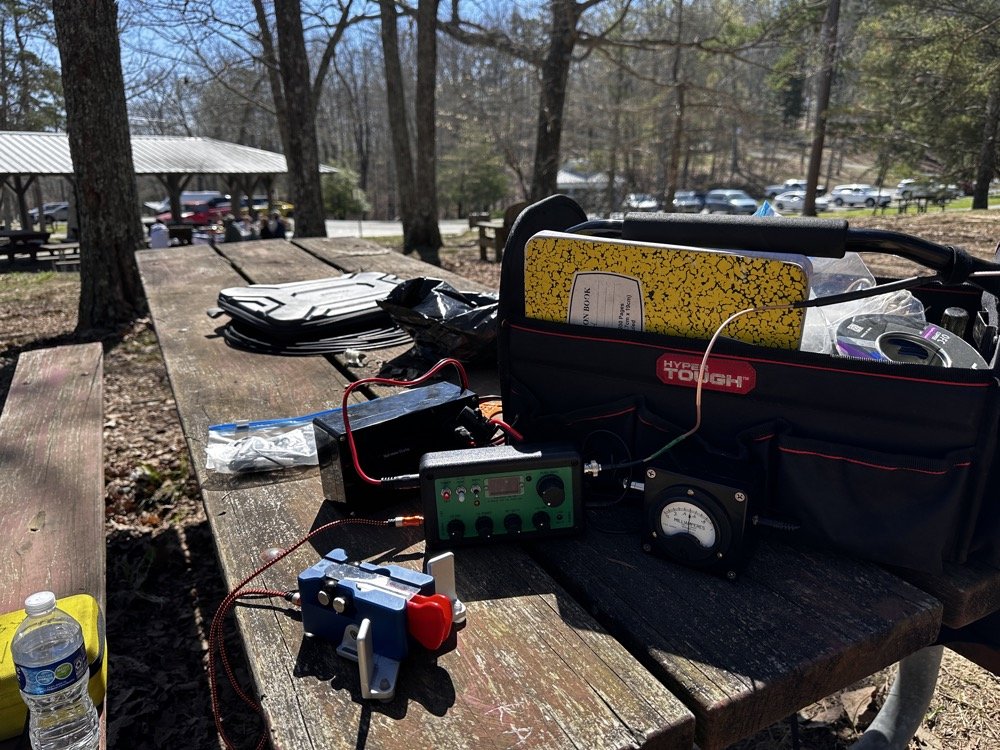 POTA station consisting of the Penntek TR-35, homebrew S meter, homebrew powerpack, Begali Traveler CW key and Relianca Antenna wtih ABR Industries Coax