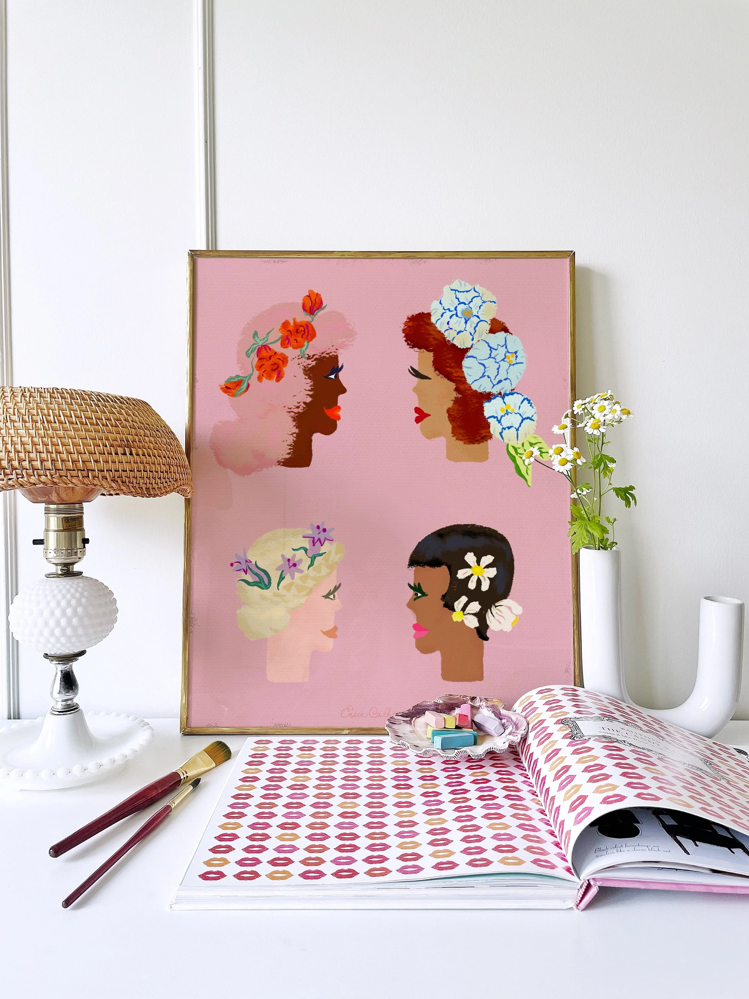 “Flower Ladies” floral portrait art print by Erica Catherine, framed in a neutral setting. A colorful, whimsical illustration of women with flowers in their hair.