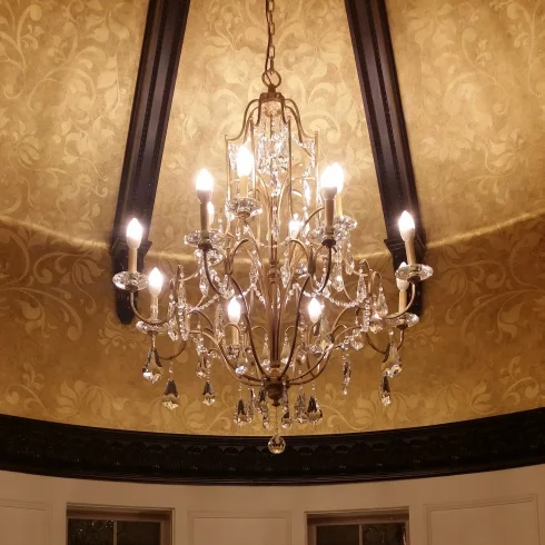The Crystal chandelier hanging from the ceiling