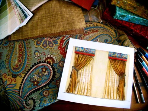 Paisley fabric pattern, a photo and markers with wooden background