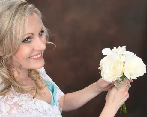 Azure Elizabeth holding a white roses with her beautiful smile