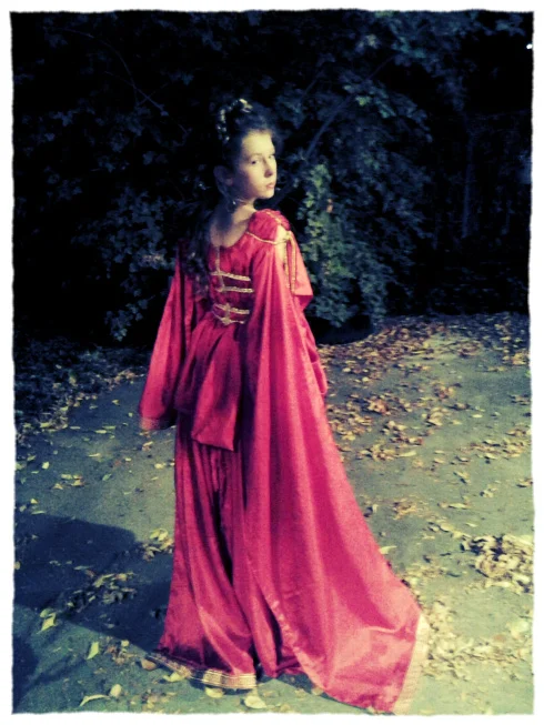 Azure Elizabeth’s daughter wearing red and gold aphrodite costume