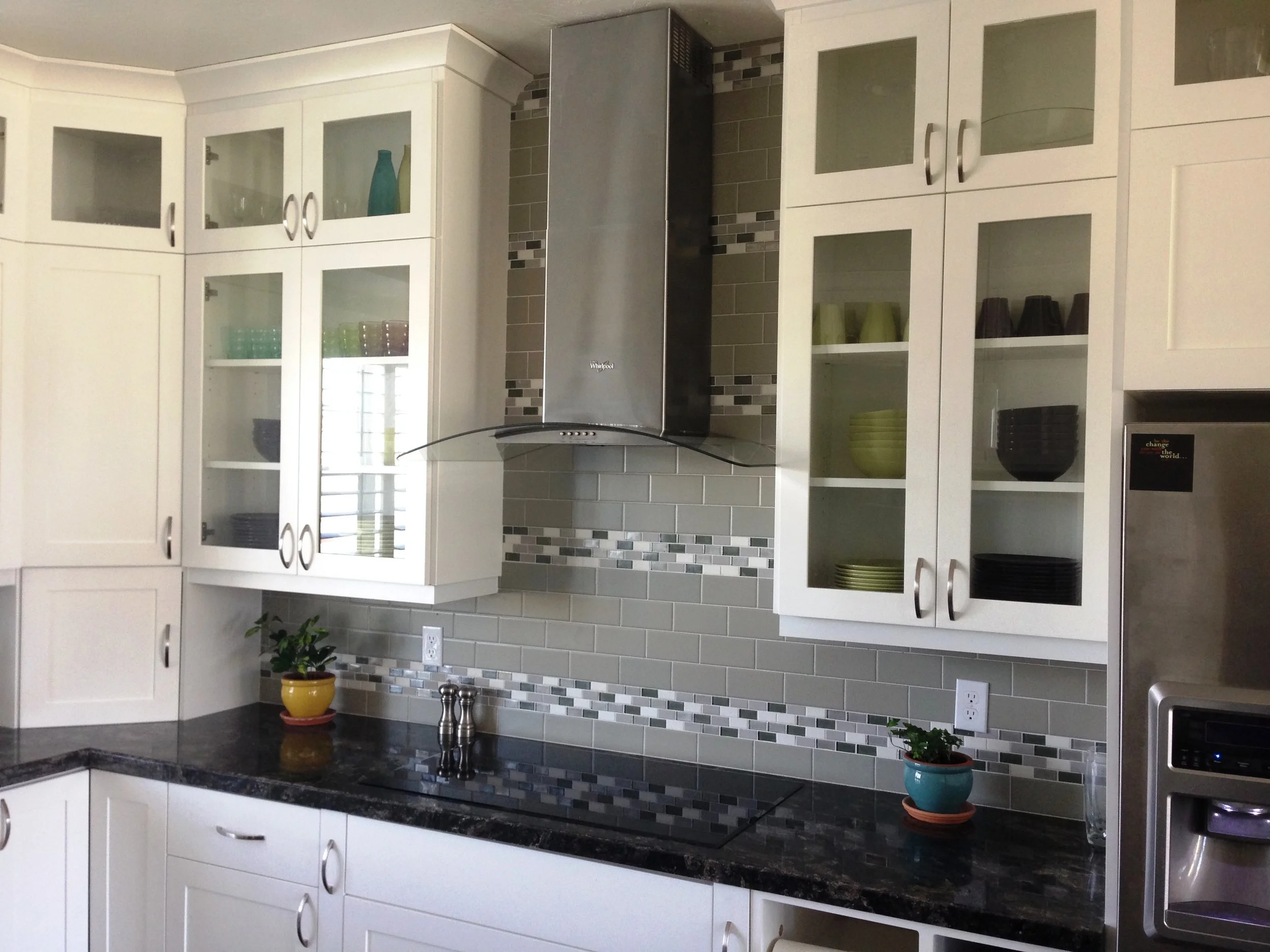 Kitchen with granite countertop and white wooden cabinet