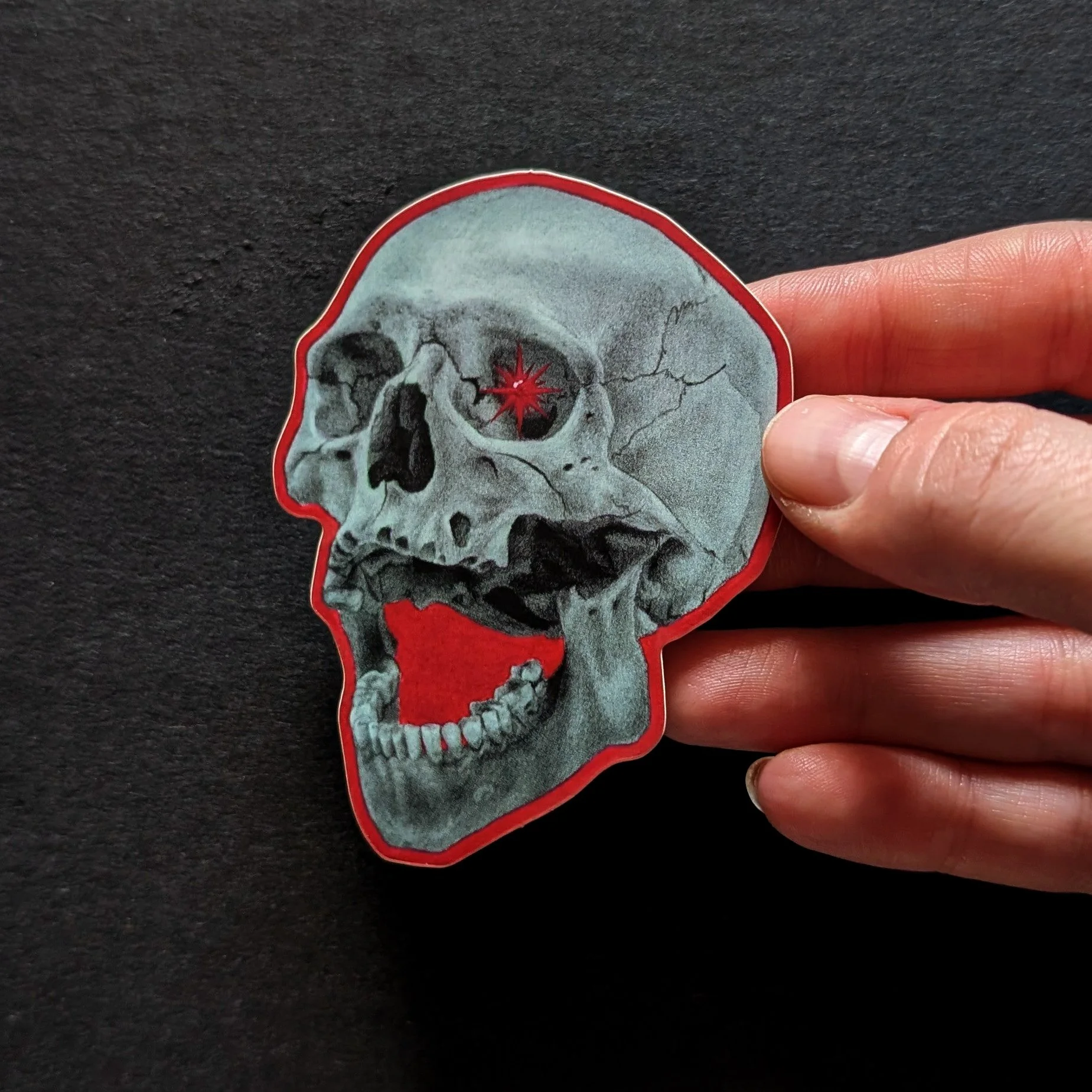 skull in red sticker.jpg