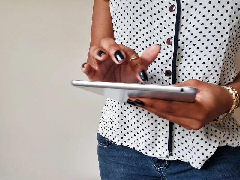 black-woman-holding-ipad-createherstock.jpg