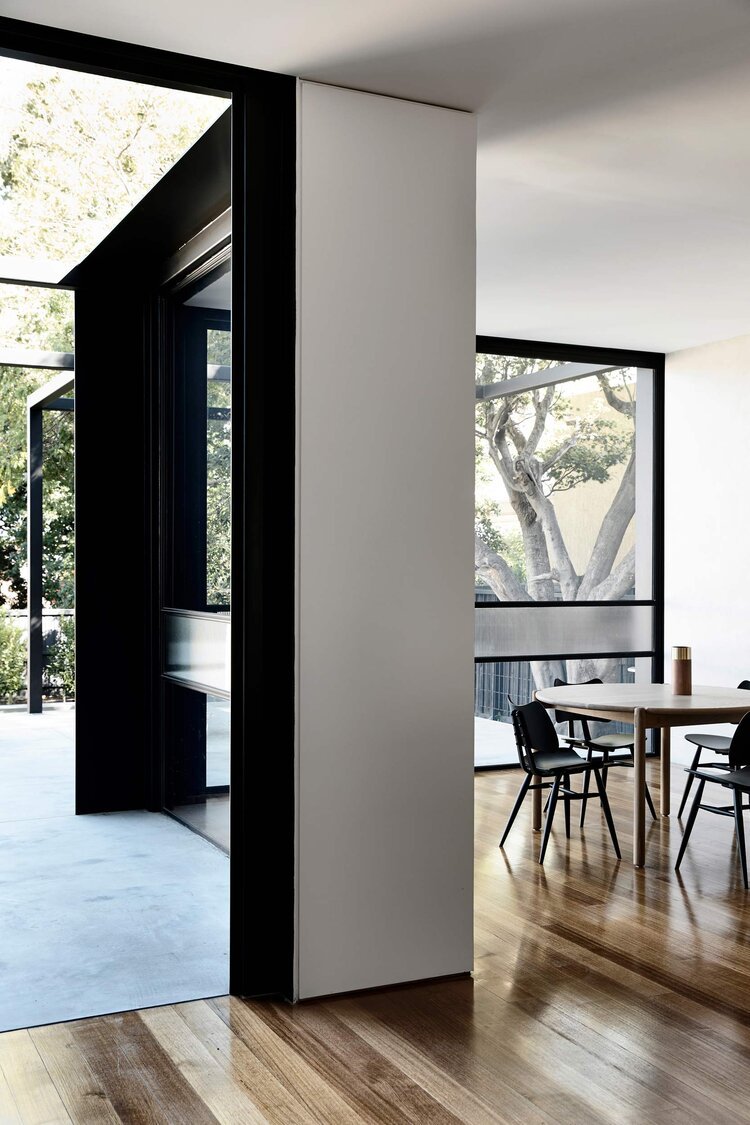minimalist+black+steel-frame+with+floor-to-ceiling+glass+was.jpeg