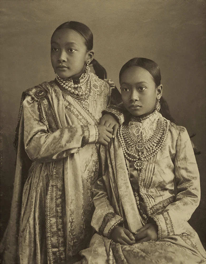 Princesses Kumudini (left) and Nalini (seated right), daughters of Monmohini Devi, in formal Indian costume with European influences. Photographed by Bir Chandra Manikya. Platinum palladium print. c. 1890.