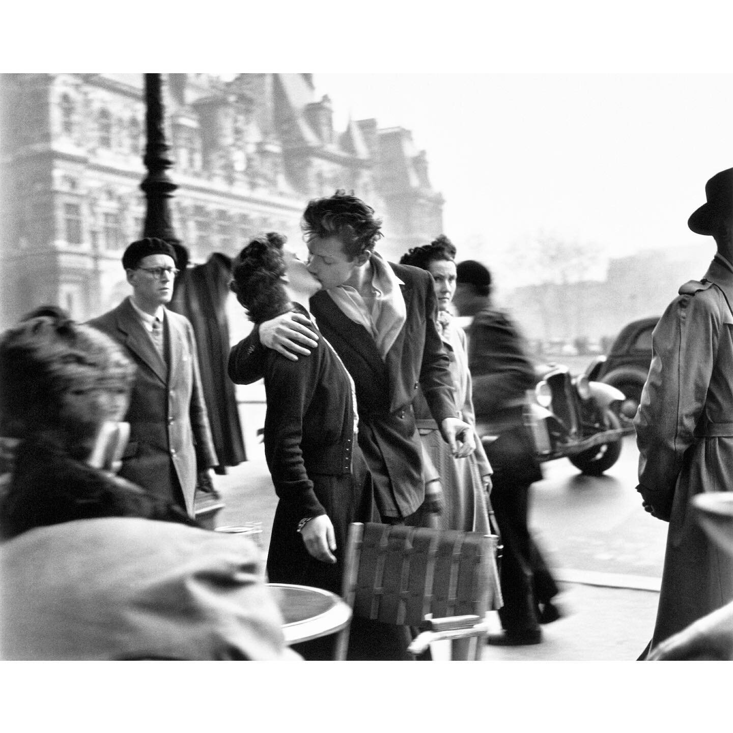 Another by Robert Doisneau. In 1950 Doisneau created this, his most recognizable work &ndash; Le Baiser de l'Hôtel de Ville (Kiss by the Hôtel de Ville), a photograph of a couple kissing in the busy streets of Paris, which became an internationally