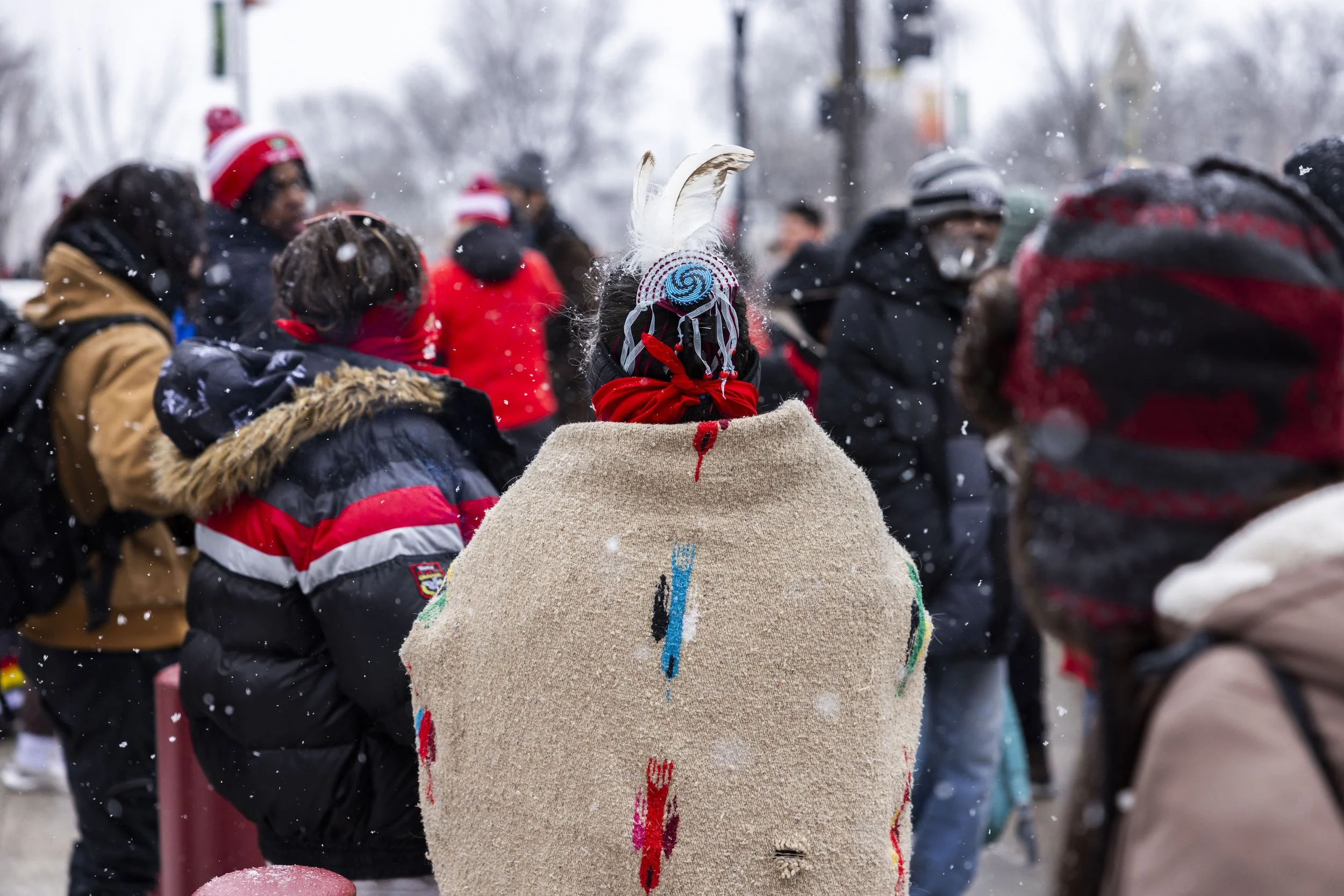 Community members conclude the march amid softly falling snow during the Missing and Murdered Indigenous Relatives (MMIR) March on Feb. 14, 2025, in Minneapolis.