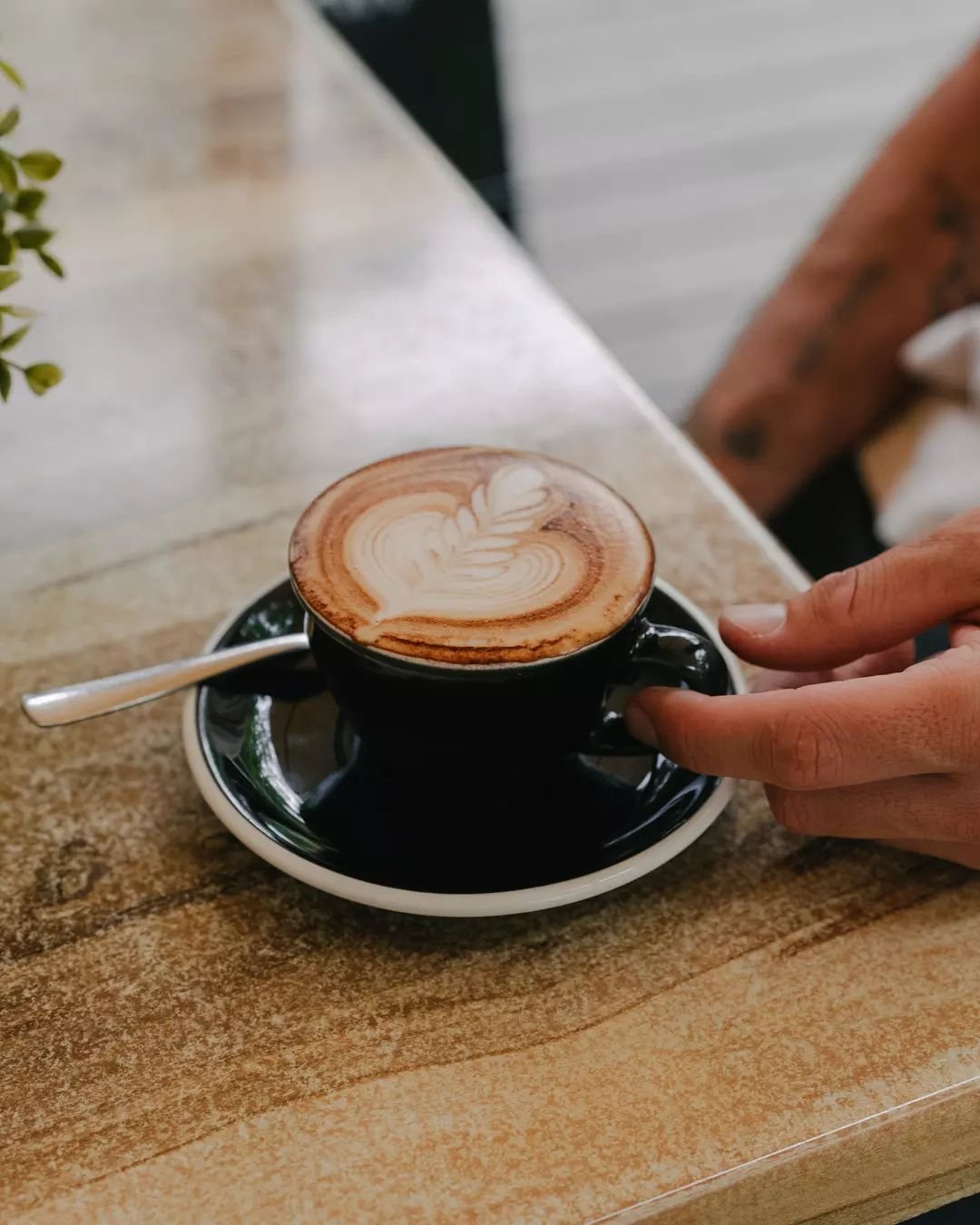 Cradle a cup of crafted perfection 🤎☕. In the heart of our cafe, every espresso swirl tells a story. Come find your chapter. 

#EspressoLove #CafeMoments #LatteArtistry #CoffeeTime #BaristaCraft