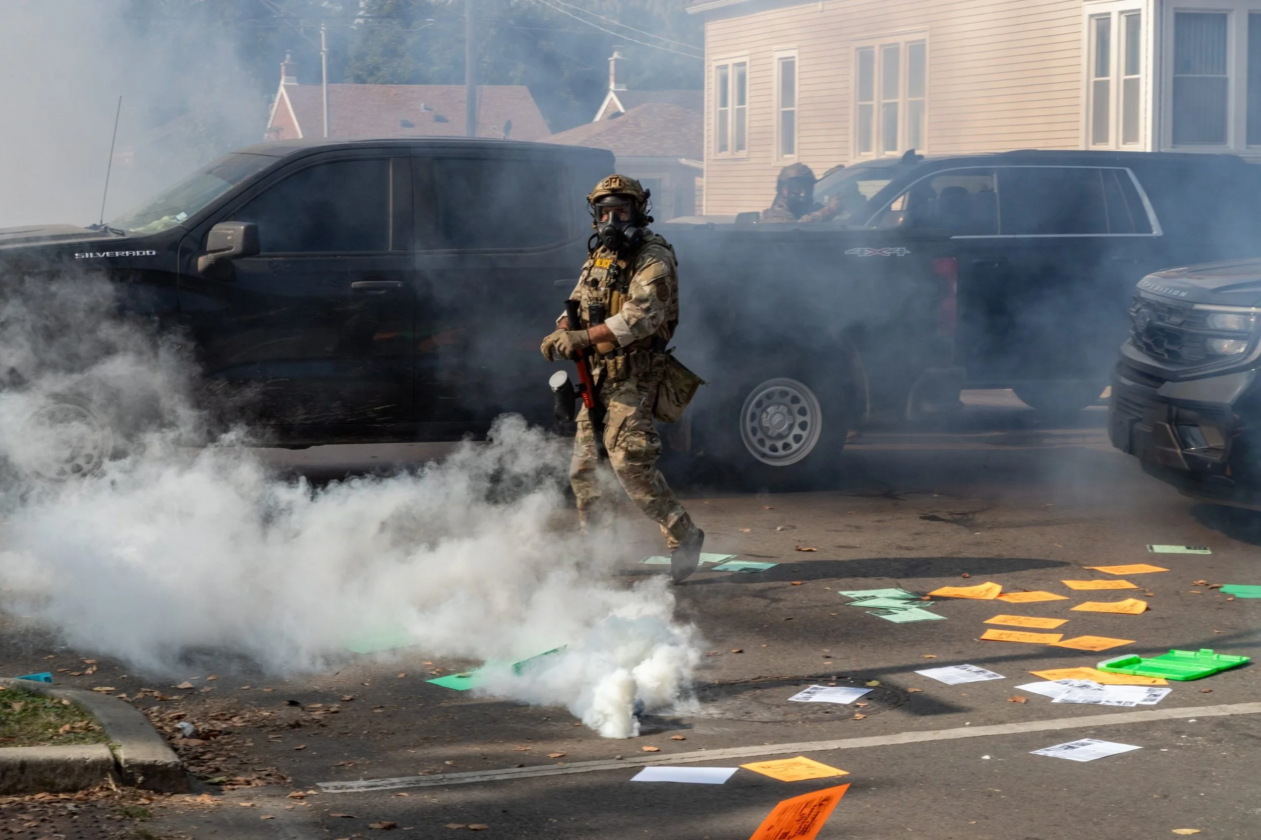  Agents deploy smoke bombs at 105th and Avenue N on Chicago's East Side during a tense standoff with residents. Credit: Matthew Kaplan for Block Club Chicago. 