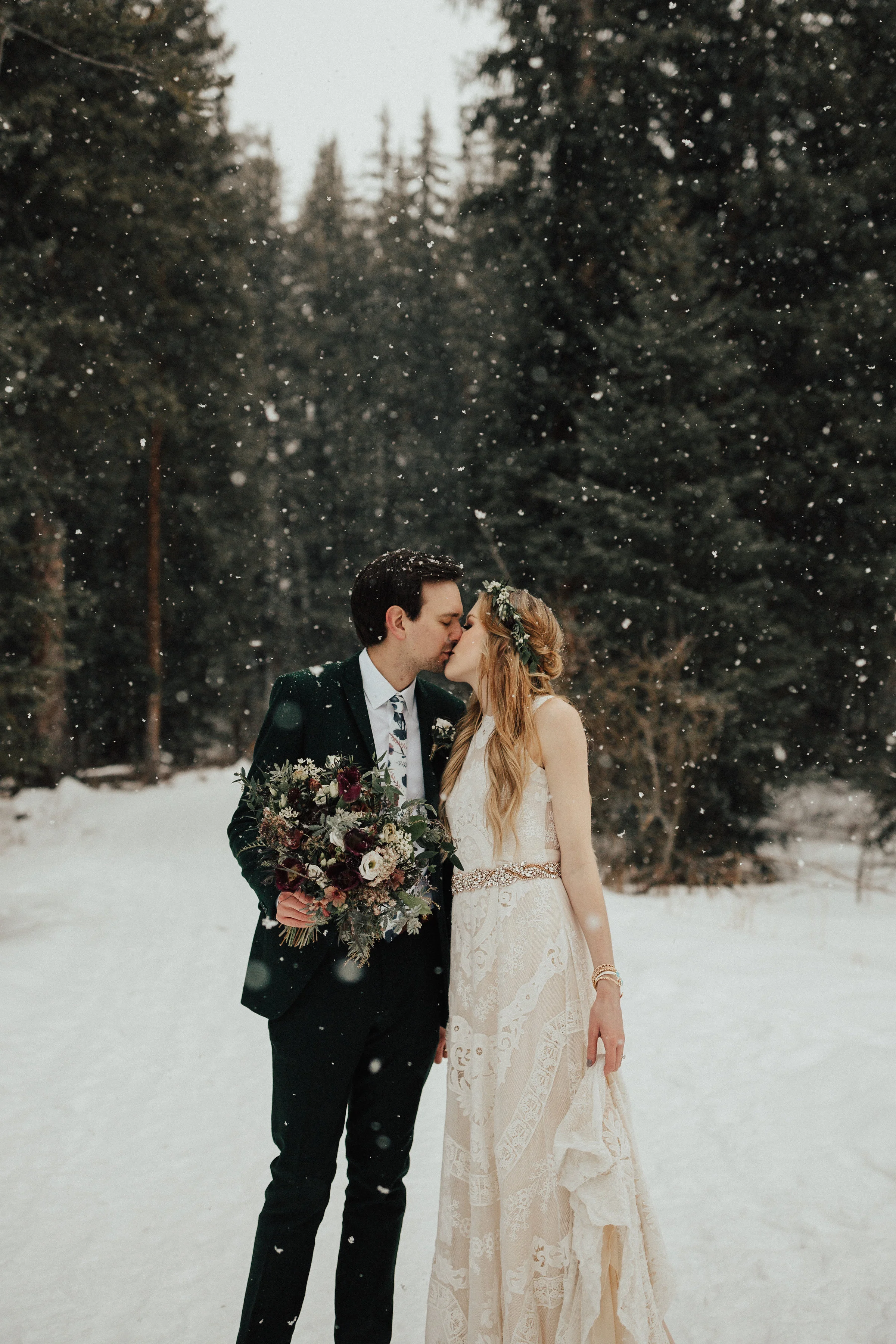 bohemian bride and groom holding unique elizabeth mckenzie floral bouquet.jpg
