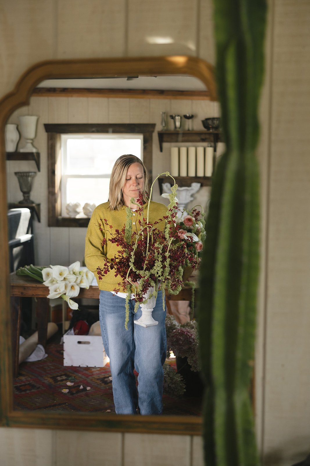Kansas City wedding florist Saige designing colorful, artful wedding florals in her home studio