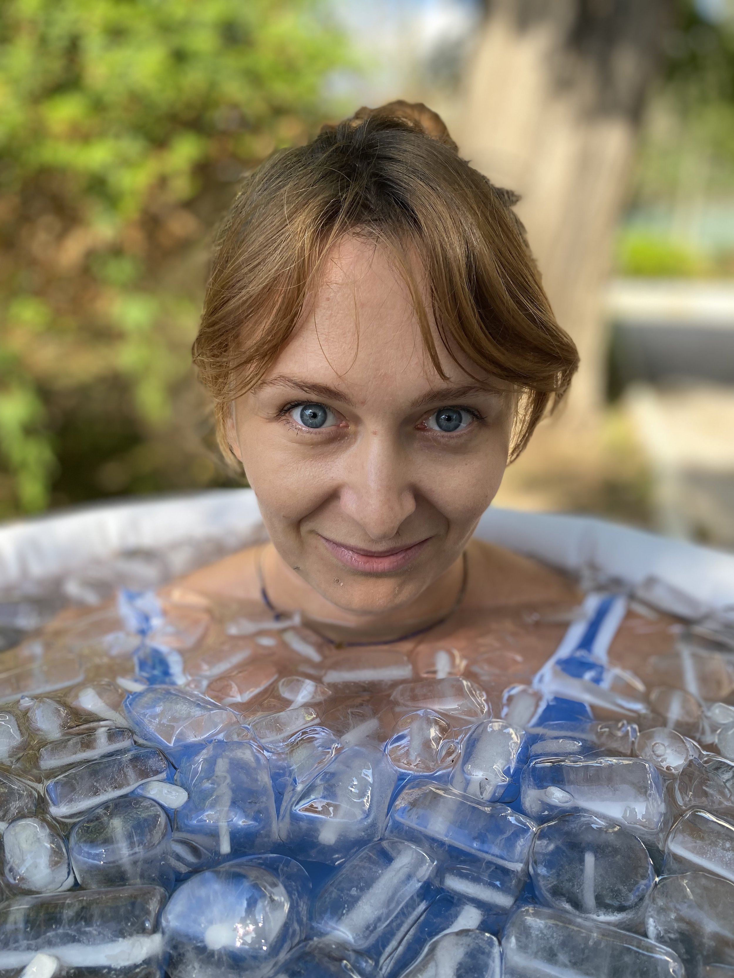 Happy woman in Wim Hof Method ice bath (Copy)