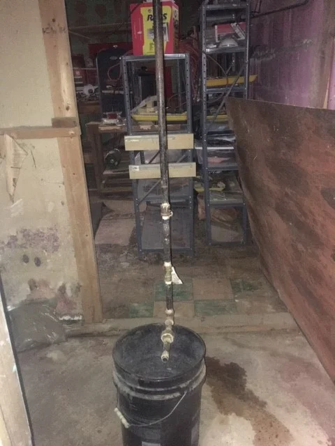 Exposed piping in Ronald’s basement.