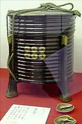 An example of a later-period, buke- style kaioke . Note the simple black lacquer with the mon prominently displayed.
