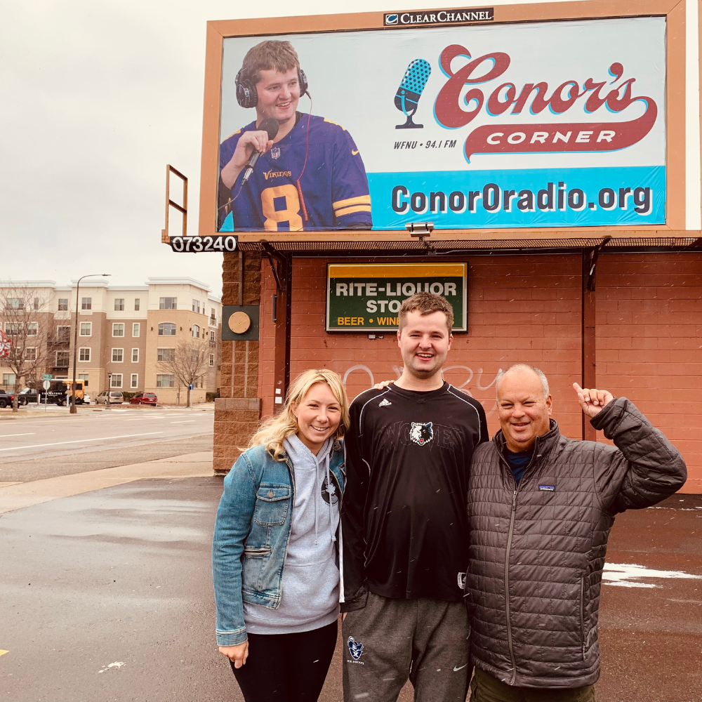 Conor and crew outside his new billboard on Snelling Ave!