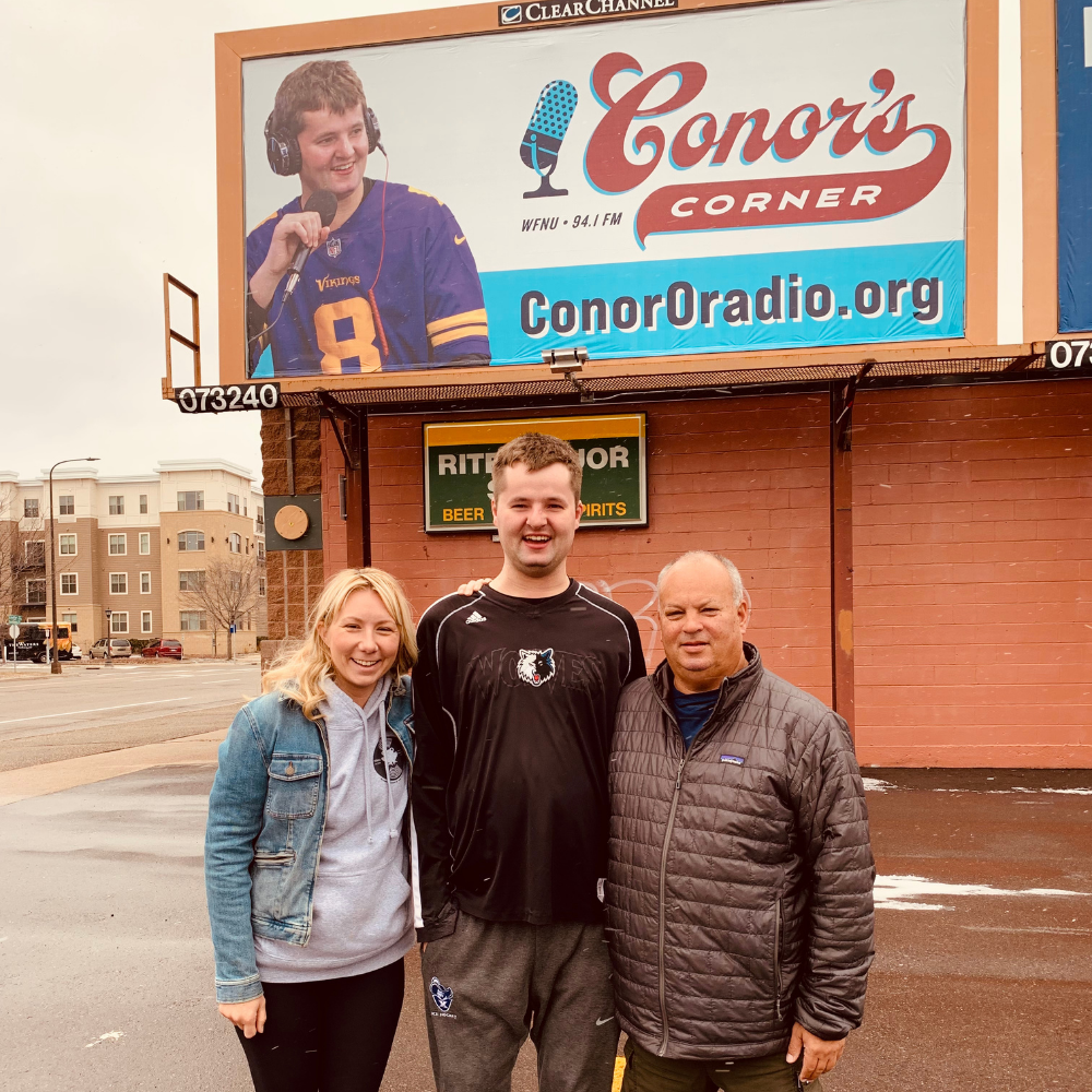 Conor and crew outside his new billboard on Snelling Ave!